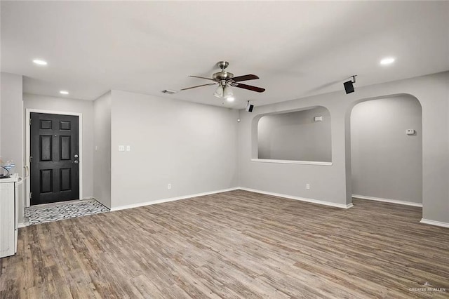 unfurnished room featuring ceiling fan and wood-type flooring