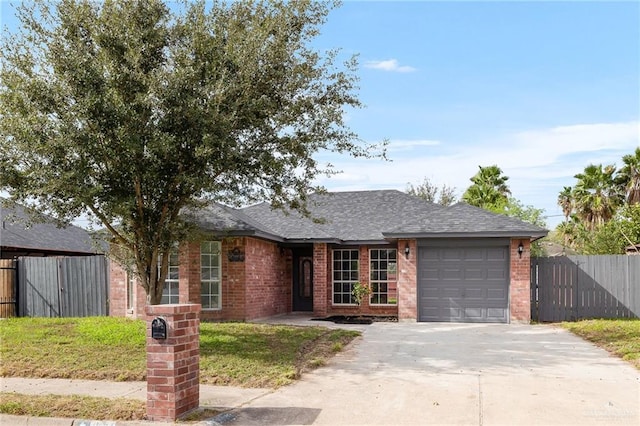 ranch-style house featuring a garage and a front yard