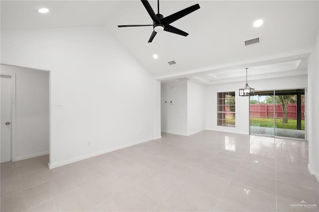 tiled empty room with ceiling fan and high vaulted ceiling