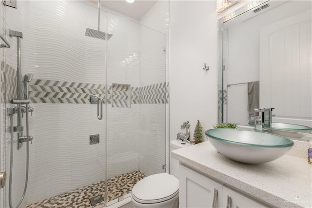 3108 E Bella Vista Ave, Alton, TX 78573 - bathroom with vanity, a shower stall, and toilet