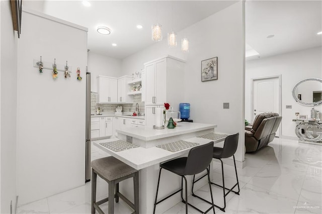 3108 E Bella Vista Ave, Alton, TX 78573 - kitchen with a kitchen bar, a sink, light marble finish floors, open shelves, and recessed lighting