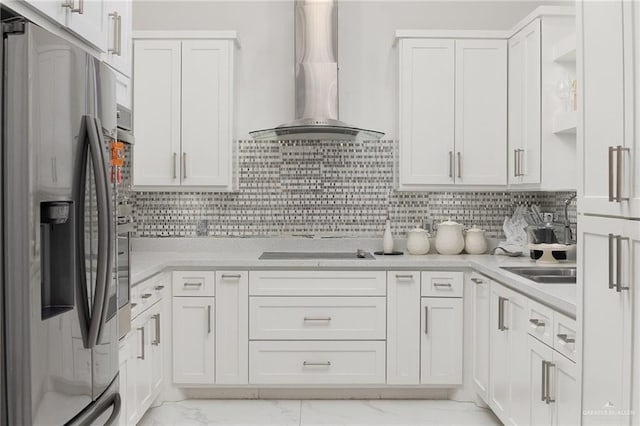 3108 E Bella Vista Ave, Alton, TX 78573 - kitchen featuring stainless steel fridge, wall chimney range hood, light marble finish flooring, black electric cooktop, and white cabinets