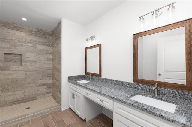 2013 Mynah Ave, Mcallen, TX 78504 - full bath featuring recessed lighting, a sink, double vanity, and tiled shower