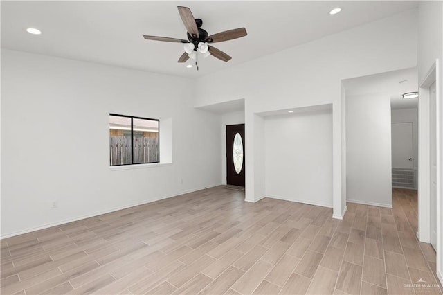 2013 Mynah Ave, Mcallen, TX 78504 - unfurnished living room featuring ceiling fan, baseboards, light wood-type flooring, and recessed lighting