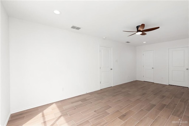 2013 Mynah Ave, Mcallen, TX 78504 - unfurnished room featuring ceiling fan, light wood finished floors, visible vents, and recessed lighting