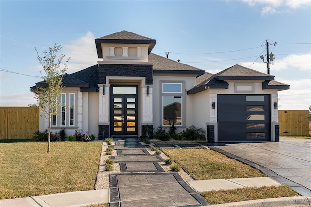 prairie-style home featuring a garage, fence, driveway, french doors, and stucco siding