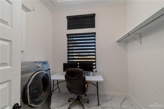 office area featuring washer / clothes dryer, marble finish floor, and baseboards