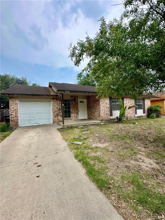 view of front of property with covered porch and a garage