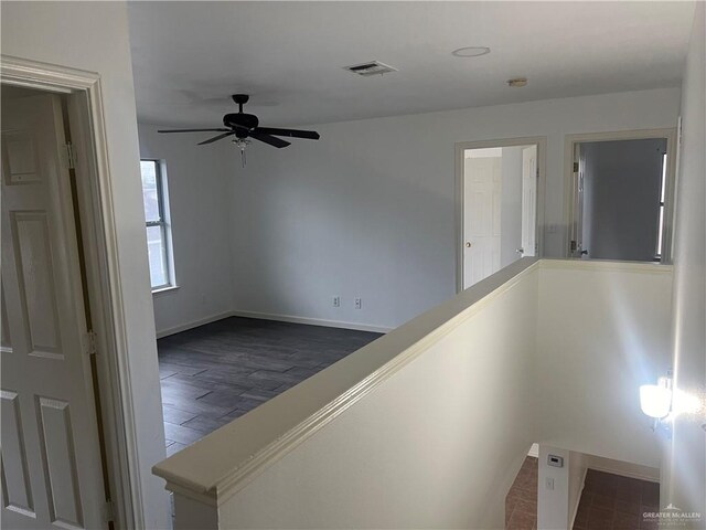 hallway with dark hardwood / wood-style floors