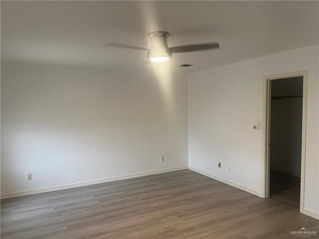 spare room featuring ceiling fan and wood-type flooring