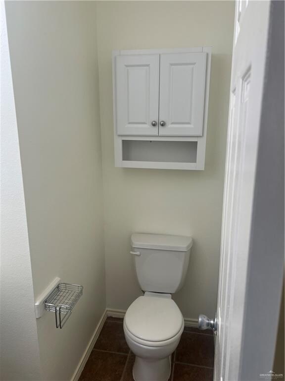 bathroom with tile patterned floors and toilet