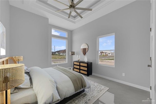 1012 Azalea St, Mission, TX 78573 - bedroom with baseboards, a tray ceiling, and a ceiling fan