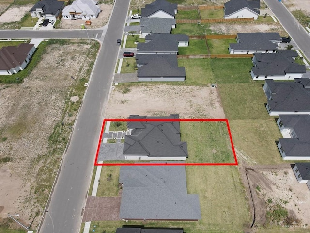 birds eye view of property with a residential view