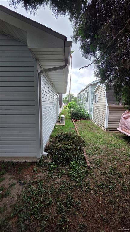 2422 Starling Cir E, Palmview, TX 78572 - view of property exterior with a lawn