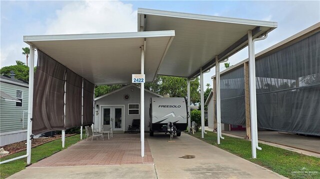 2422 Starling Cir E, Palmview, TX 78572 - view of patio featuring french doors and a carport