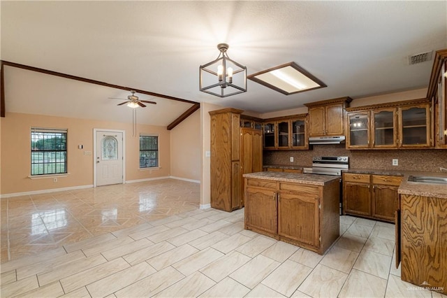 kitchen with sink, vaulted ceiling, pendant lighting, electric stove, and backsplash