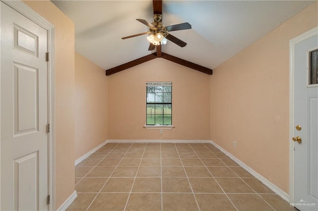 unfurnished room with ceiling fan, lofted ceiling with beams, and light tile patterned floors