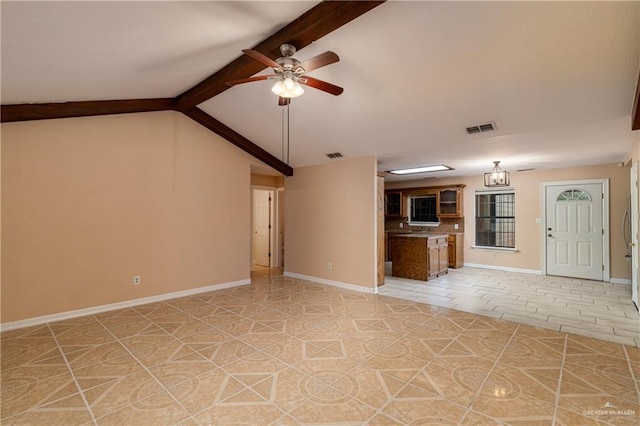 unfurnished living room featuring lofted ceiling with beams and ceiling fan