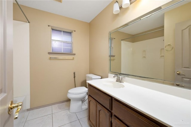 bathroom with tile patterned floors, toilet, and vanity