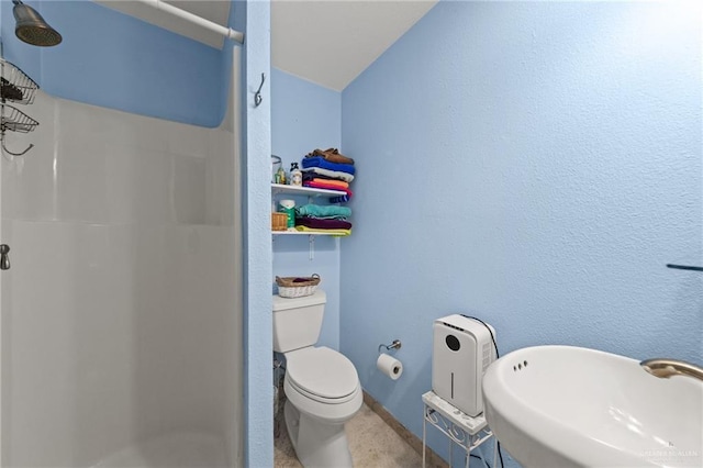 210 W Oleander St Unit B, South Padre Island, TX 78597 - bathroom featuring a stall shower and a sink