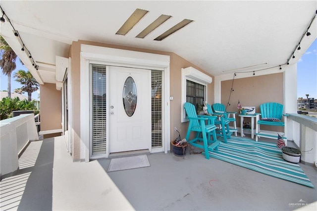210 W Oleander St Unit B, South Padre Island, TX 78597 - entrance to property featuring a balcony and stucco siding