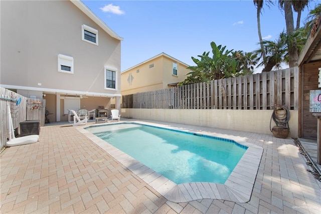 210 W Oleander St Unit B, South Padre Island, TX 78597 - view of swimming pool featuring a patio and a fenced backyard