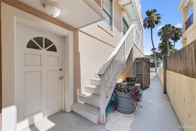 210 W Oleander St Unit B, South Padre Island, TX 78597 - doorway to property with stucco siding