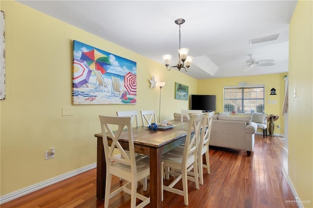 210 W Oleander St Unit B, South Padre Island, TX 78597 - dining area with wood finished floors, a chandelier, and a ceiling fan