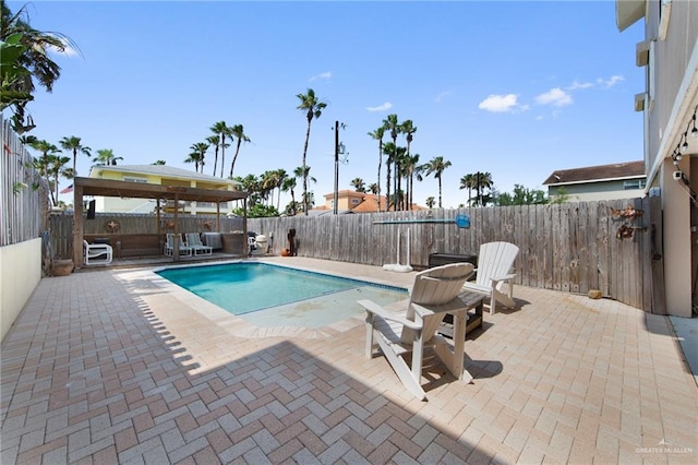 210 W Oleander St Unit B, South Padre Island, TX 78597 - view of swimming pool featuring a patio and a fenced backyard
