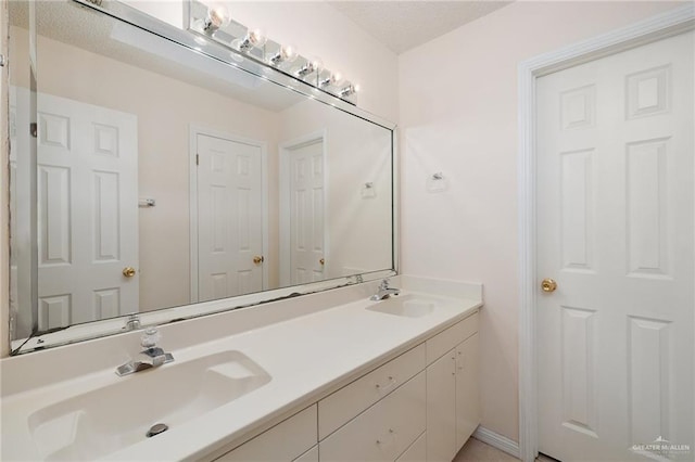 bathroom featuring double vanity and a sink