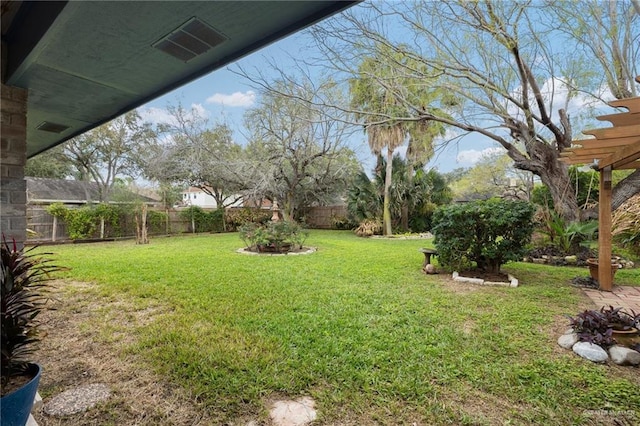 view of yard with a fenced backyard, visible vents, and a pergola