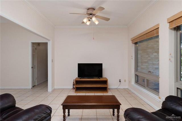 living room with light tile patterned floors, baseboards, and crown molding