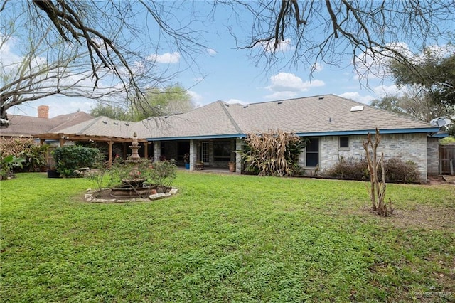 rear view of property featuring roof with shingles, a lawn, a patio, and fence