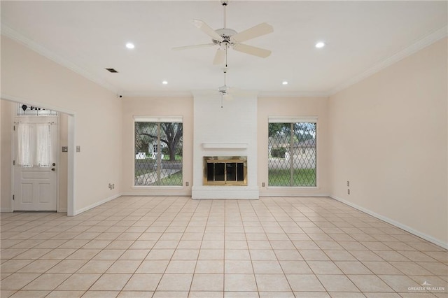 unfurnished living room with a glass covered fireplace, a wealth of natural light, and crown molding