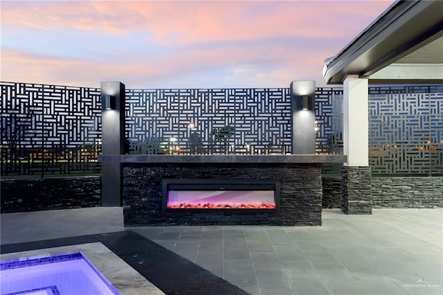 view of patio terrace at dusk