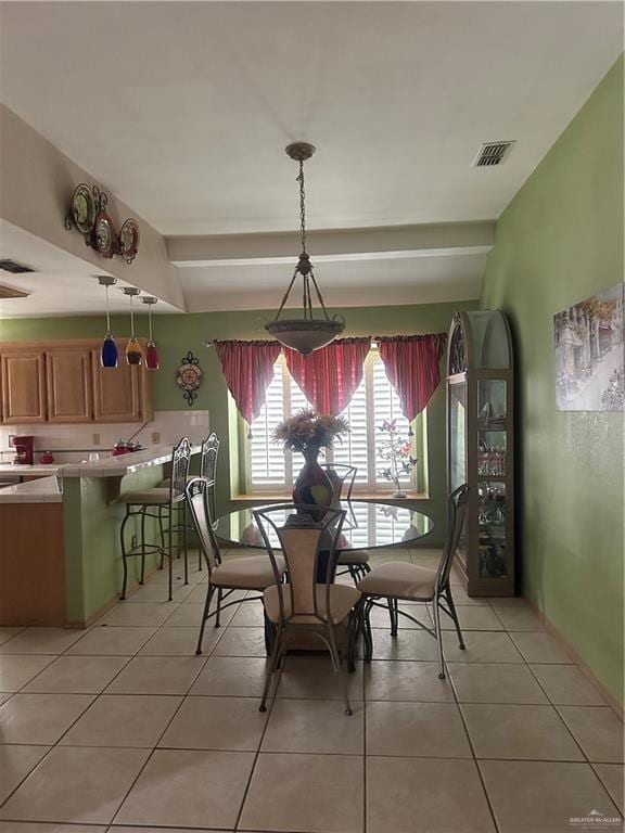 dining area featuring light tile patterned floors