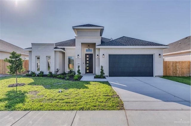 7409 55th St, Mcallen, TX 78573 - view of front of property featuring an attached garage, concrete driveway, and a shingled roof