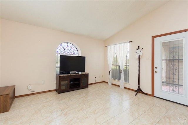 living room with a healthy amount of sunlight and lofted ceiling