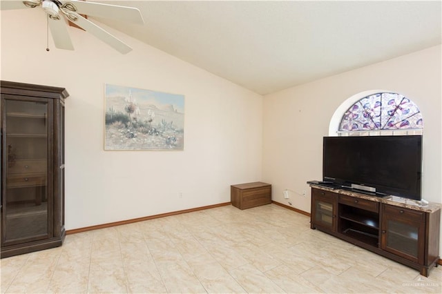 living room featuring ceiling fan and vaulted ceiling