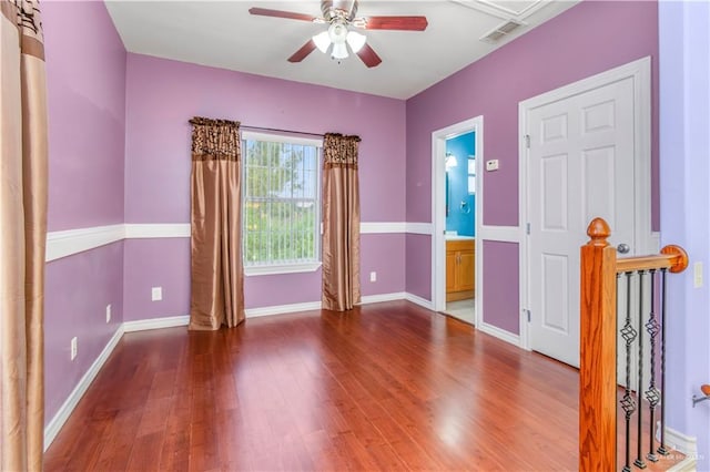 unfurnished room featuring hardwood / wood-style floors and ceiling fan