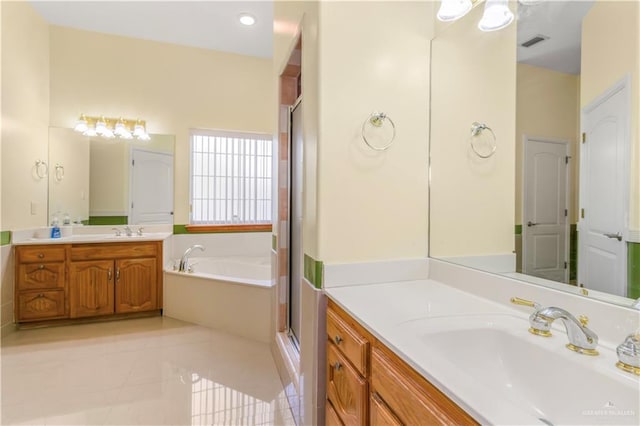 bathroom with shower with separate bathtub, vanity, and tile patterned floors