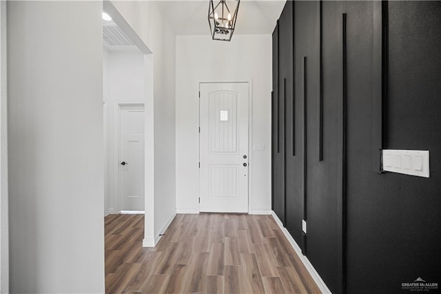 2413 N Woody St, Edinburg, TX 78541 - foyer entrance featuring wood finished floors and baseboards