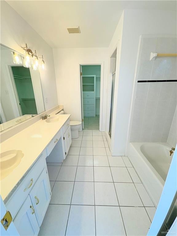 full bathroom with tile patterned flooring, vanity, toilet, and independent shower and bath