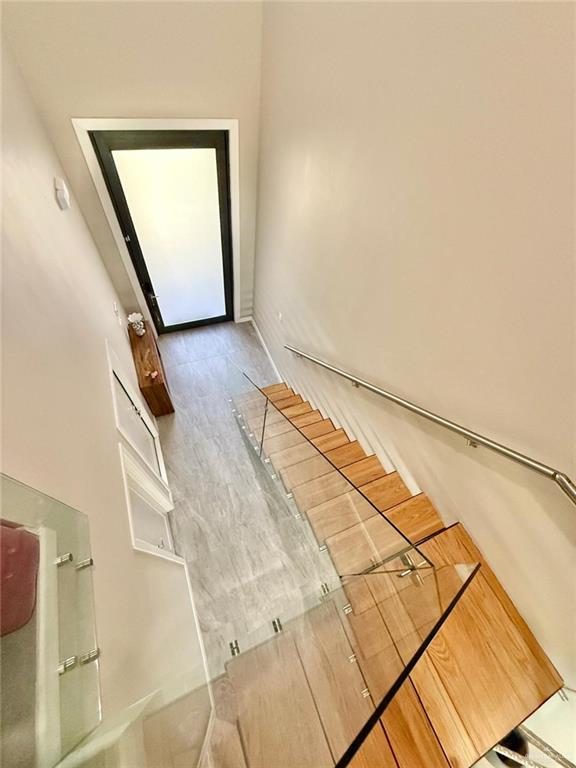 1925 Sunset Dr, Mission, TX 78572 - stairway featuring baseboards