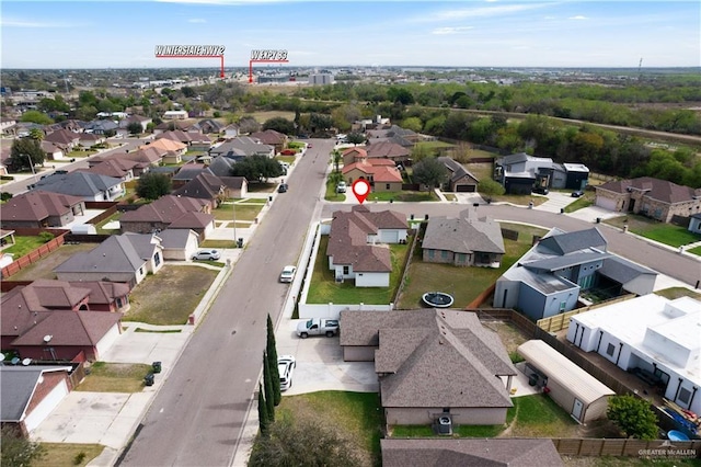 birds eye view of property with a residential view