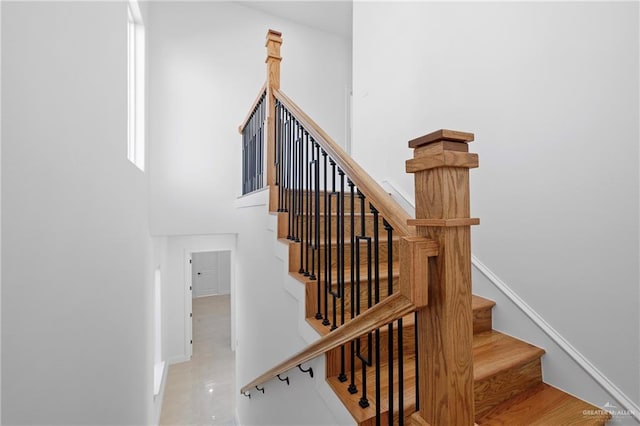 stairway featuring concrete flooring