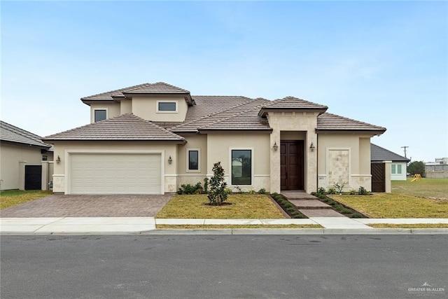 view of front facade with a front lawn and a garage