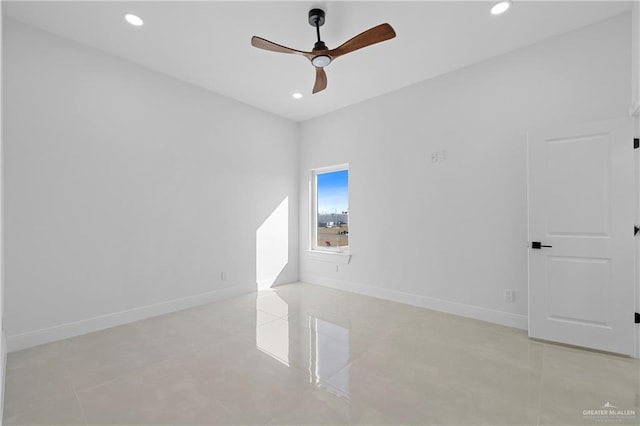 unfurnished room with ceiling fan and light tile patterned floors