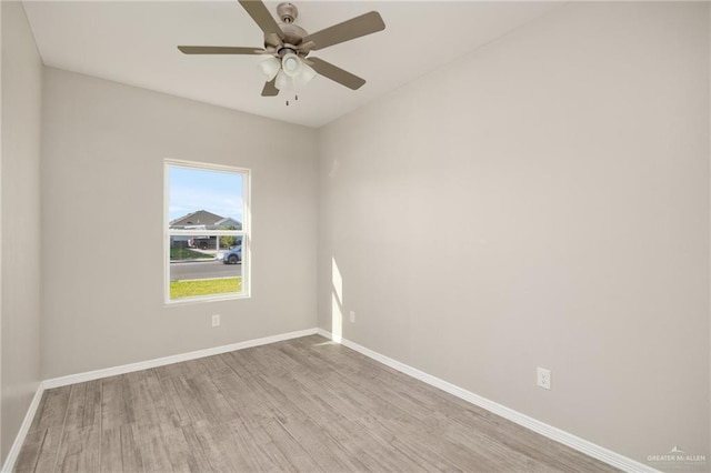 empty room with ceiling fan and light wood-type flooring