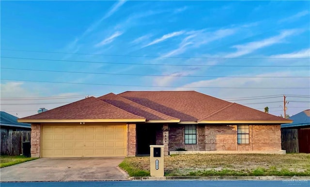 ranch-style house featuring a garage